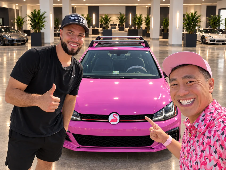 Gabriel and Yong beside the pink GTI in a level showroom composition